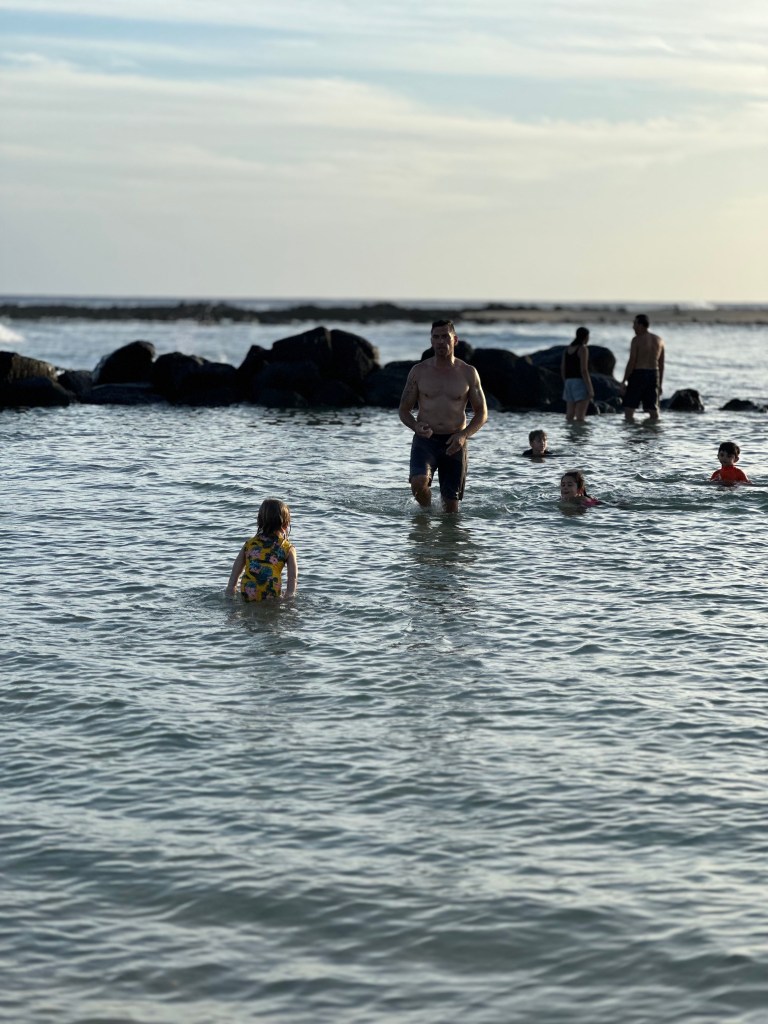 Kids playing at Poipu beach in Kauai Hawaii, kids on beach, Poipu beach, 